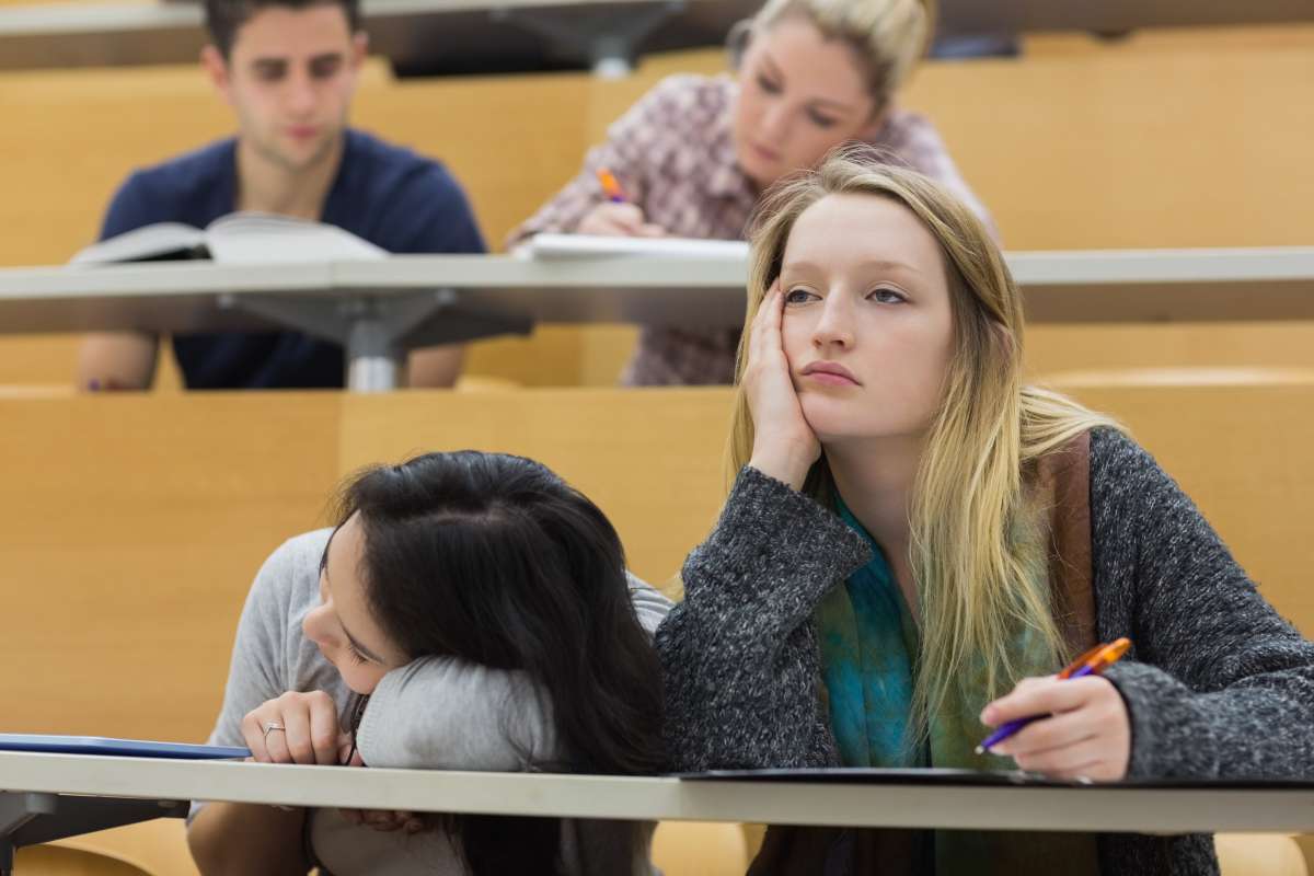 College student in lecture, looking tired