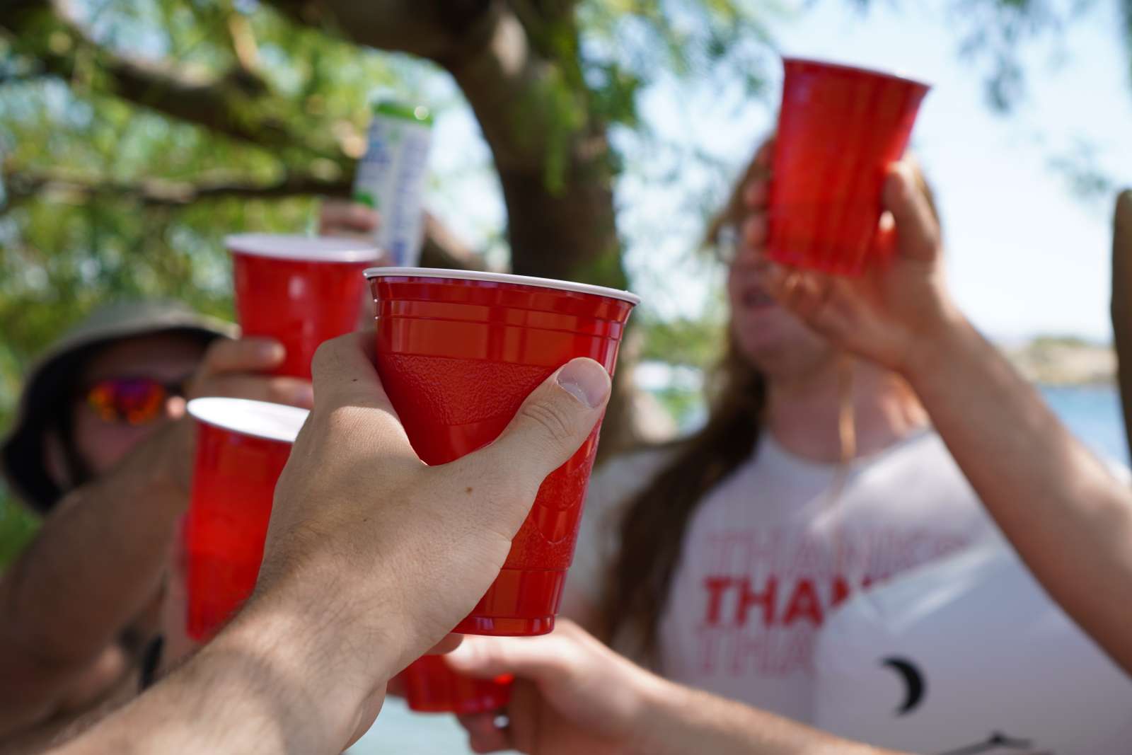 People holding red cups at a party